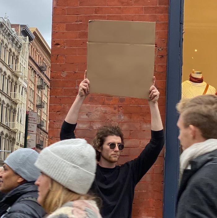 High Quality Guy Holding Cardboard Sign Blank Meme Template